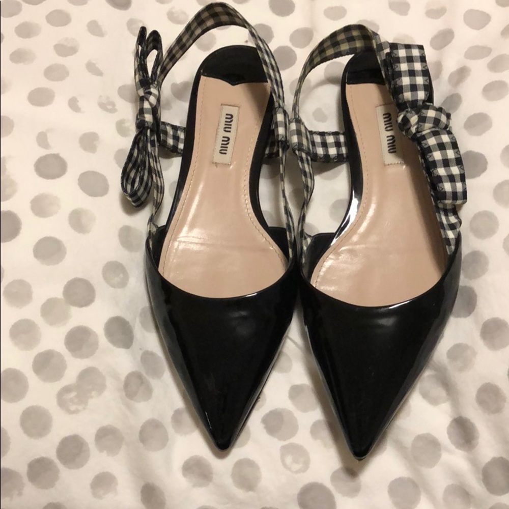 Miu Miu black patent leather flats.